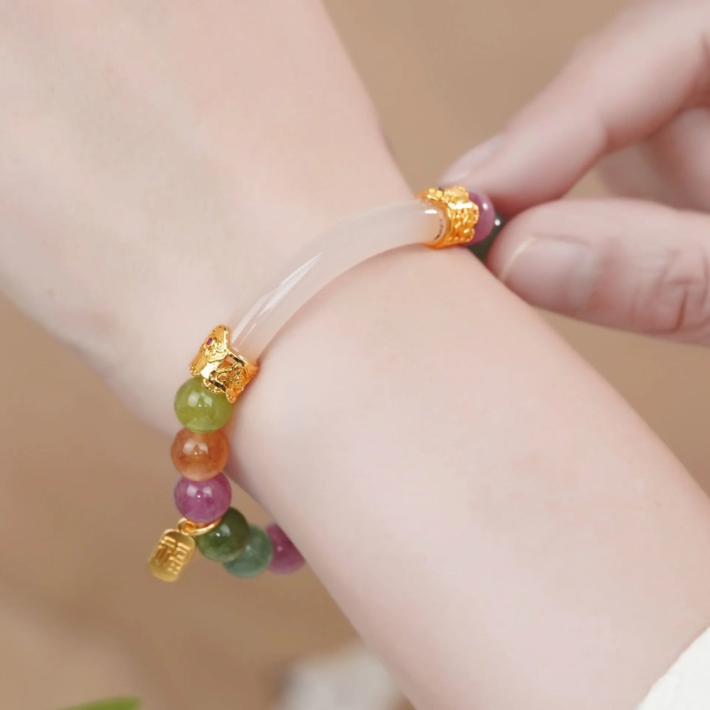 Tourmaline rainbow colour half bracelet with electroplated finish showing natural stone texture and partial wrist coverage design