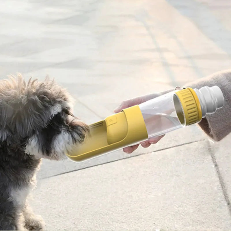 Dark blue portable dog water bottle with integrated bowl, showing compact 215x75x75mm size and one-hand operation mechanism