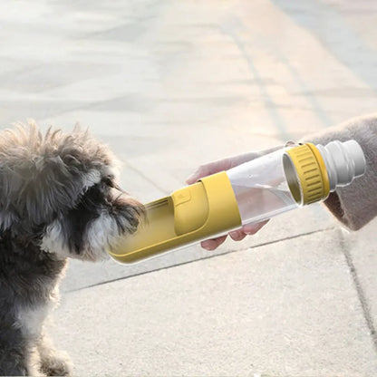 Dark blue portable dog water bottle with integrated bowl, showing compact 215x75x75mm size and one-hand operation mechanism