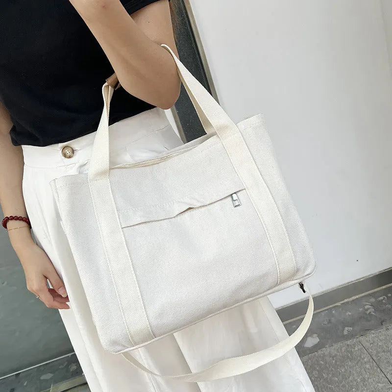 Army Green canvas tote bag showing open top with internal laptop pocket and organisers.