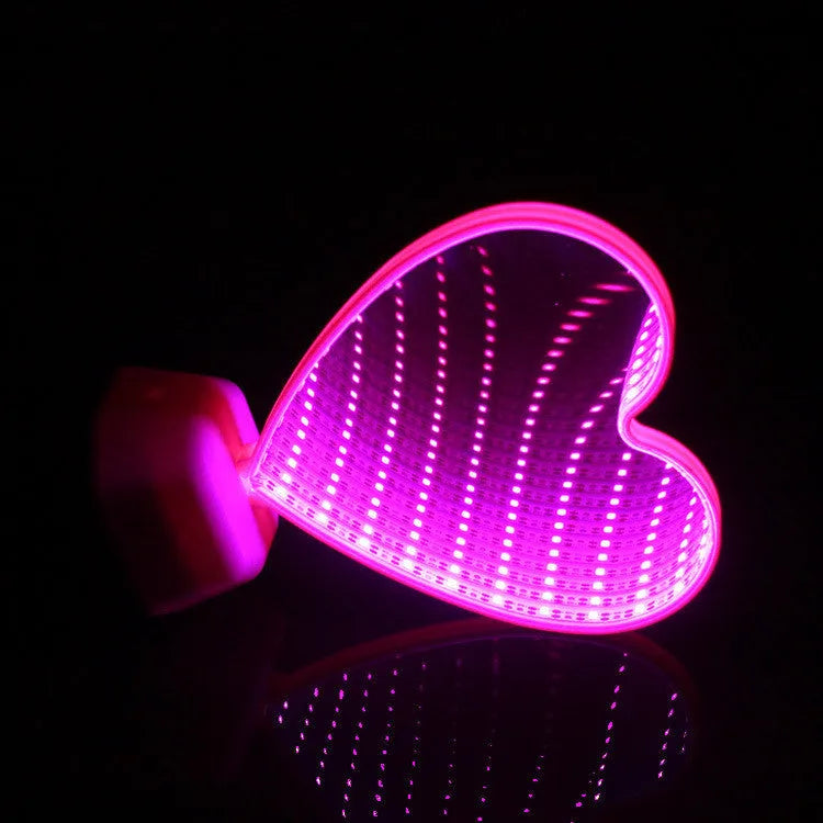 Double-sided LED love tunnel light with rose red illumination on a plastic base.