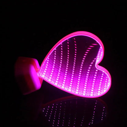 Double-sided LED love tunnel light with rose red illumination on a plastic base.