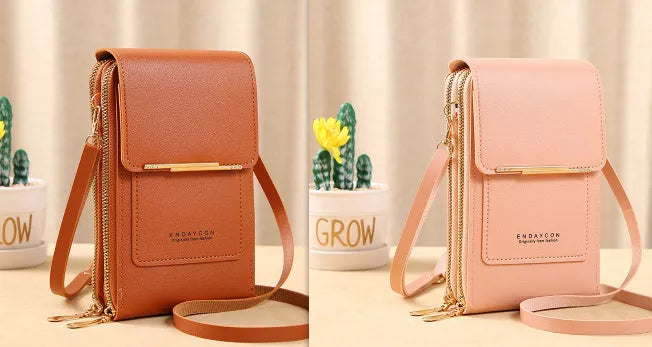 Women's messenger touch screen phone bag in solid colors with diamond decorative elements