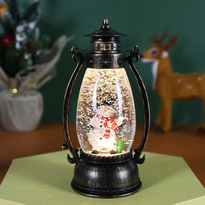 Crystal ball Christmas decoration with LED-lit paper snowman and elderly figures on desktop