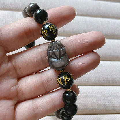 Men's silver stone bracelet with engraved proverb beads and Chinese zodiac style on a wrist.