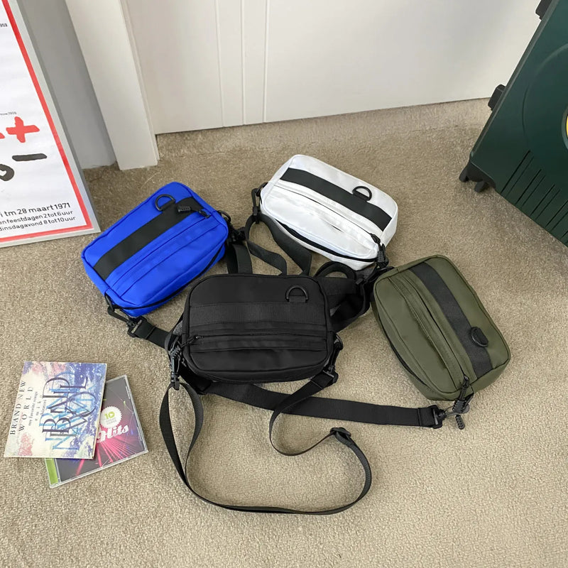Men's nylon messenger bag with street style and wear-resistant polyester lining, measuring 22cm length, 5cm width and 14cm height, available in black, blue, green or white for daily crossbody use