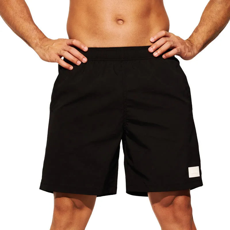 Men's quick-drying nylon beach shorts in four colours with straight leg opening