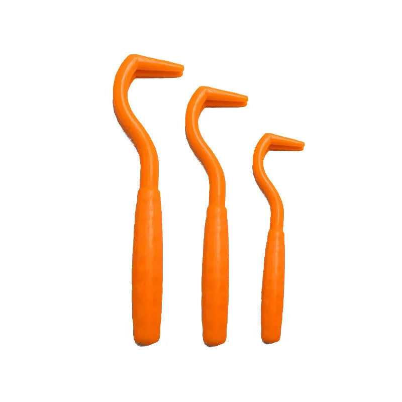 Set of three coloured tick hook removal tools for dogs on a white background.