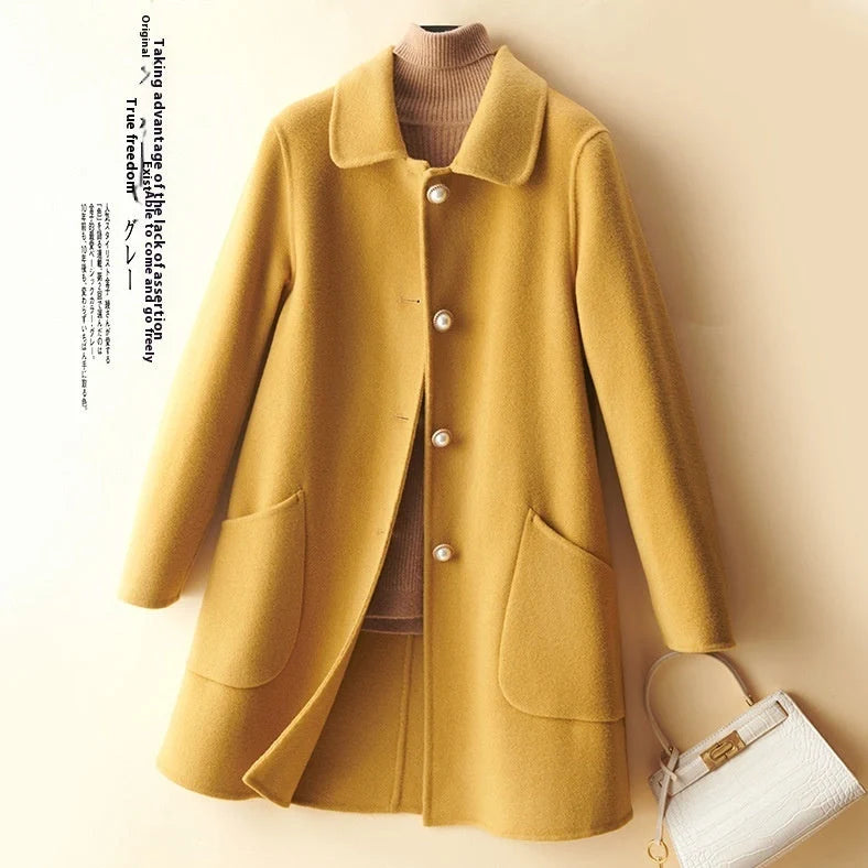 Women's black wool mid-length coat with doll collar and pearl buckle, showing double-faced fabric and 65cm length.