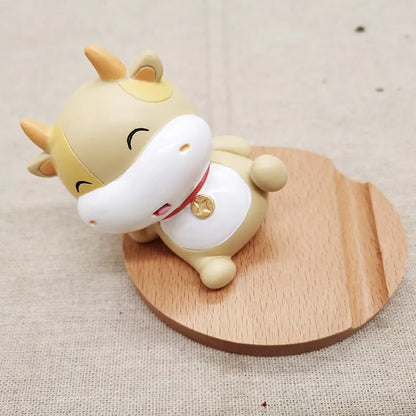 Beech wood mobile phone holder with coin slot showing adjustable angle and resin decorative elements