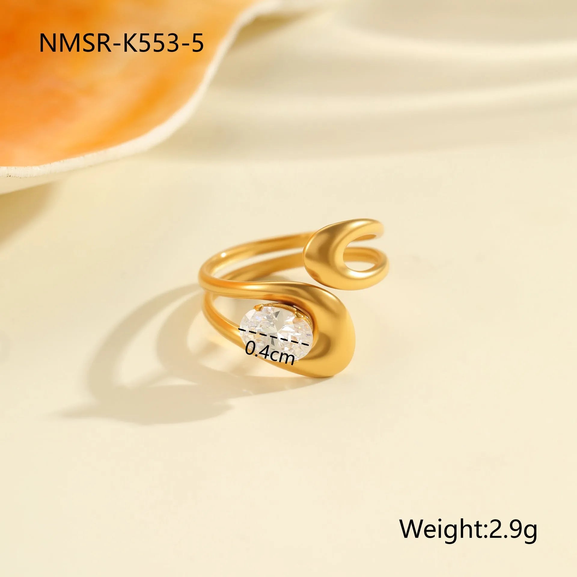 Geometric zircon ring showing round, oval and quadrangular design elements in stainless steel with electroplated finish