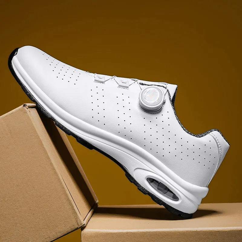 Low-top black mesh casual tennis shoes with cross shoulder straps and white composite sole