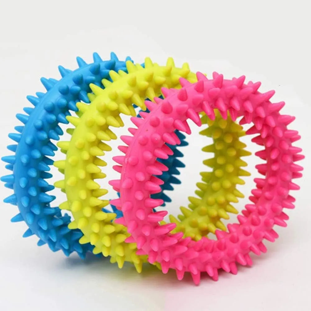 TPR spiky circle ring dog chew toy in assorted colours showing dental cleaning nubs