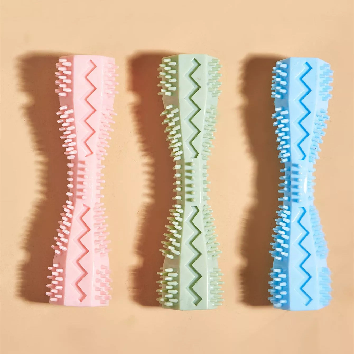 Hexagonal TPR chew toy for dogs in green, blue, or pink for teeth cleaning and anxiety relief