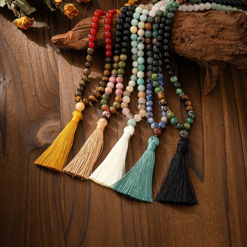 Vintage bohemian-style long beaded sweater chain with a tassel, showing necklace and bracelet lengths.