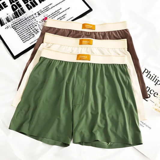 Men's loose-fit Ice Silk nylon underwear in a three-pack, showing colour options like black, green, and grey.