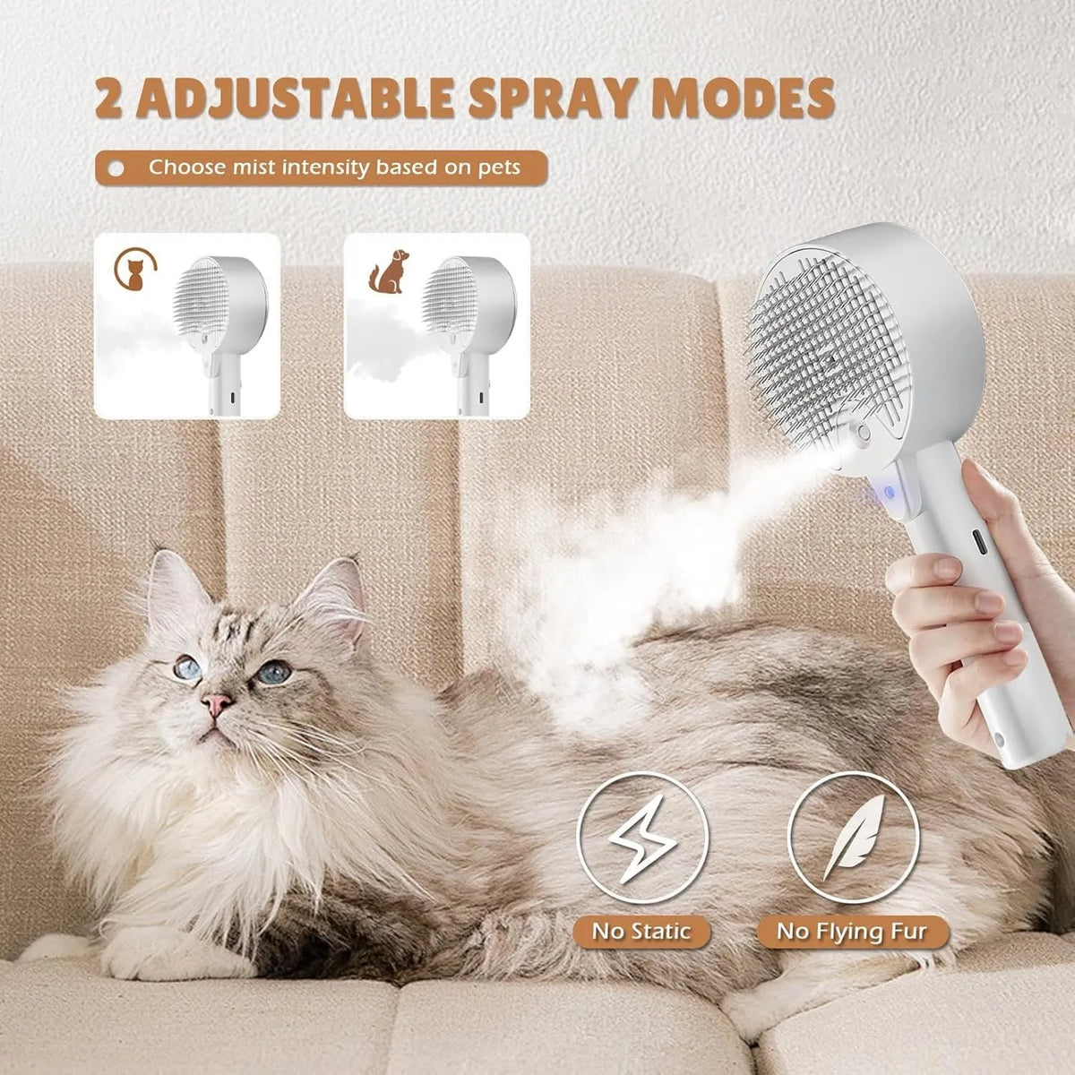 Pink and white cat steam brush with mist spray function, rounded head, and stainless steel comb bristles.