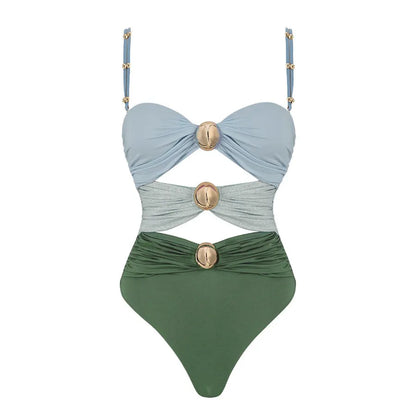 Women's green one-piece swimsuit with round buckle decoration and hollow-out stitching detail on nylon fabric.