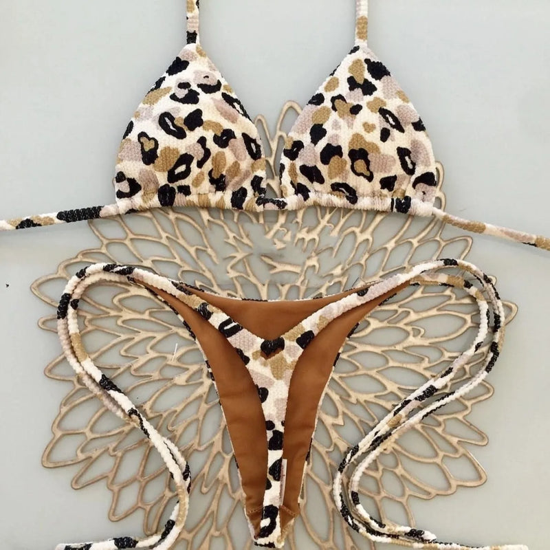 Women's swimsuit bikini beachwear for swimming in printed polyester nylon fabric with cotton lining, high elasticity for a secure fit, available in adult sizes S, M, L in colours RT1884, RT2110 and RT2111.
