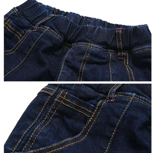 Blue striped boys' stretch denim trousers with elastic waistband showing size measurements from 110cm to 160cm