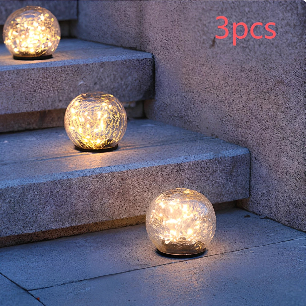 Cracked glass ball LED solar light, 10cm size with warm white glow for garden paths, waterproof and ground stake included