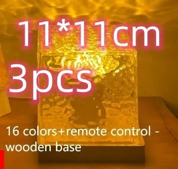 LED water ripple projection night light with remote control on wooden base showing colourful light patterns