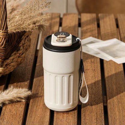 Portable digital stainless steel thermal bottle with temperature display, insulated for hot and cold drinks, designed for on-the-go use