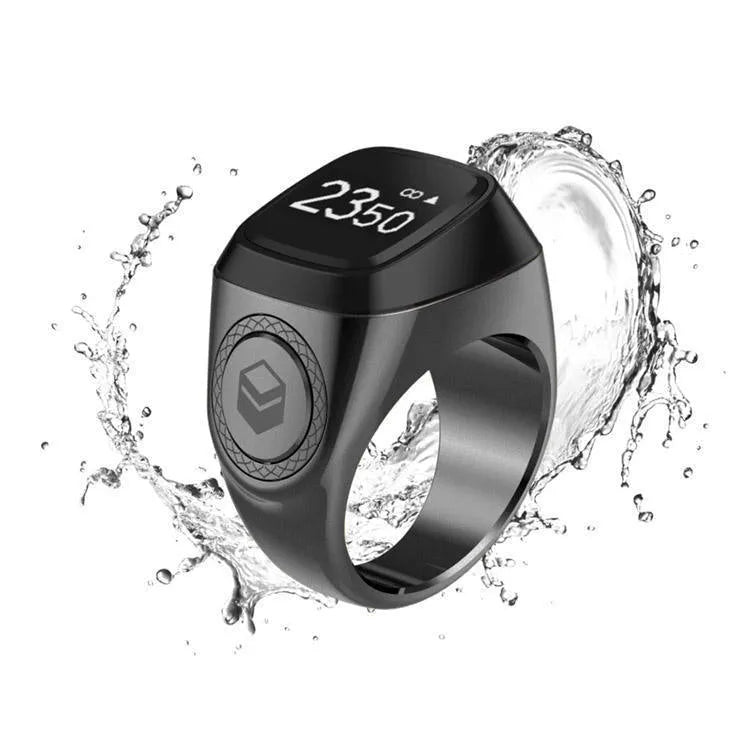 Zikr1 smart ring in metal with OLED display showing time and Tasbih count, sizes 18mm-22mm