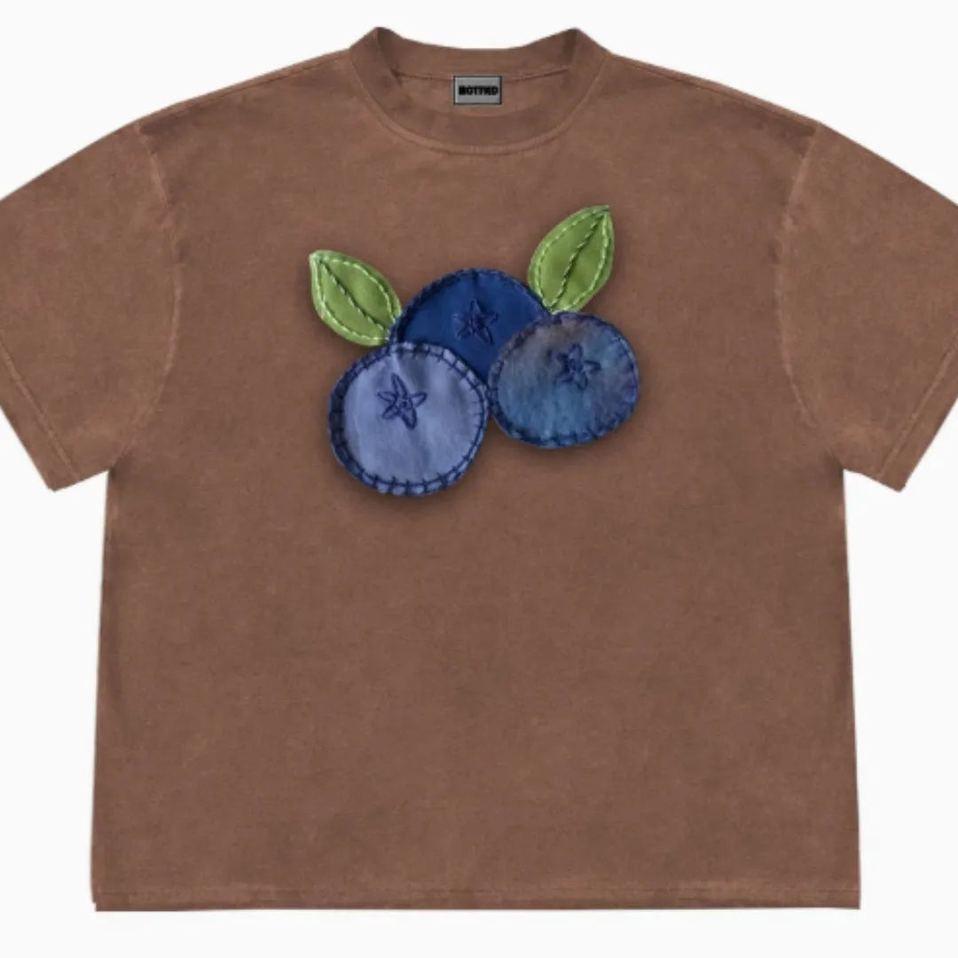 Blueberry and plant patchwork pattern on a loose-fit short sleeve Ice Oxygen Cotton T-shirt.