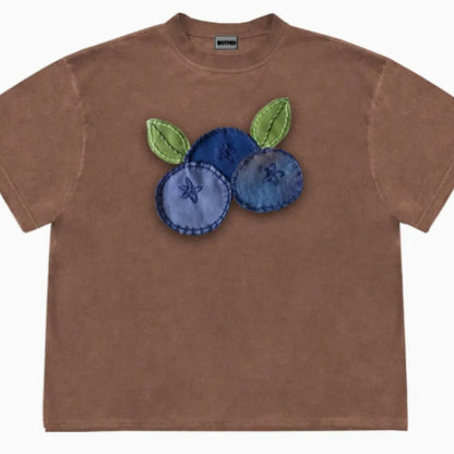 Blueberry and plant patchwork pattern on a loose-fit short sleeve Ice Oxygen Cotton T-shirt.