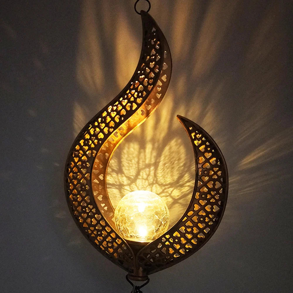 Solar wrought iron wind chime lamp with hollow flame design for garden lighting