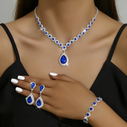Elegant bridal jewelry set with necklace, earrings, and bracelet in various colors including white, blue, red, and green