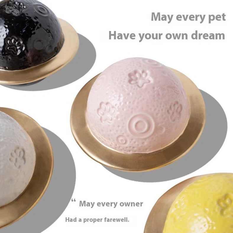 Handmade ceramic cinerary casket with cosmic starry sky design and cat-dog motifs in multiple colours