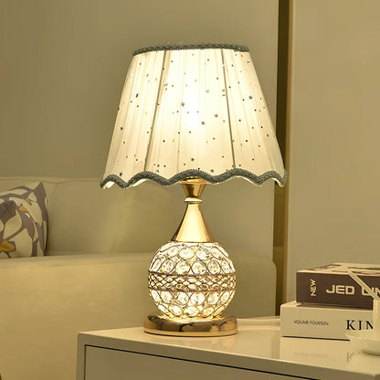 Gold crystal desk lamp 30cm tall with remote switch on bedside table, diffusing even light via manual-cut pendants