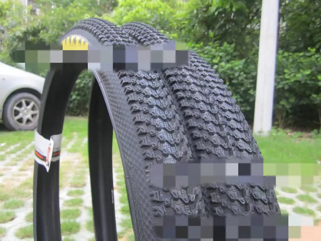 Mountain bike tyre with ultralight design, showing tread pattern and white label option, sizes from 26 to 29 inches.