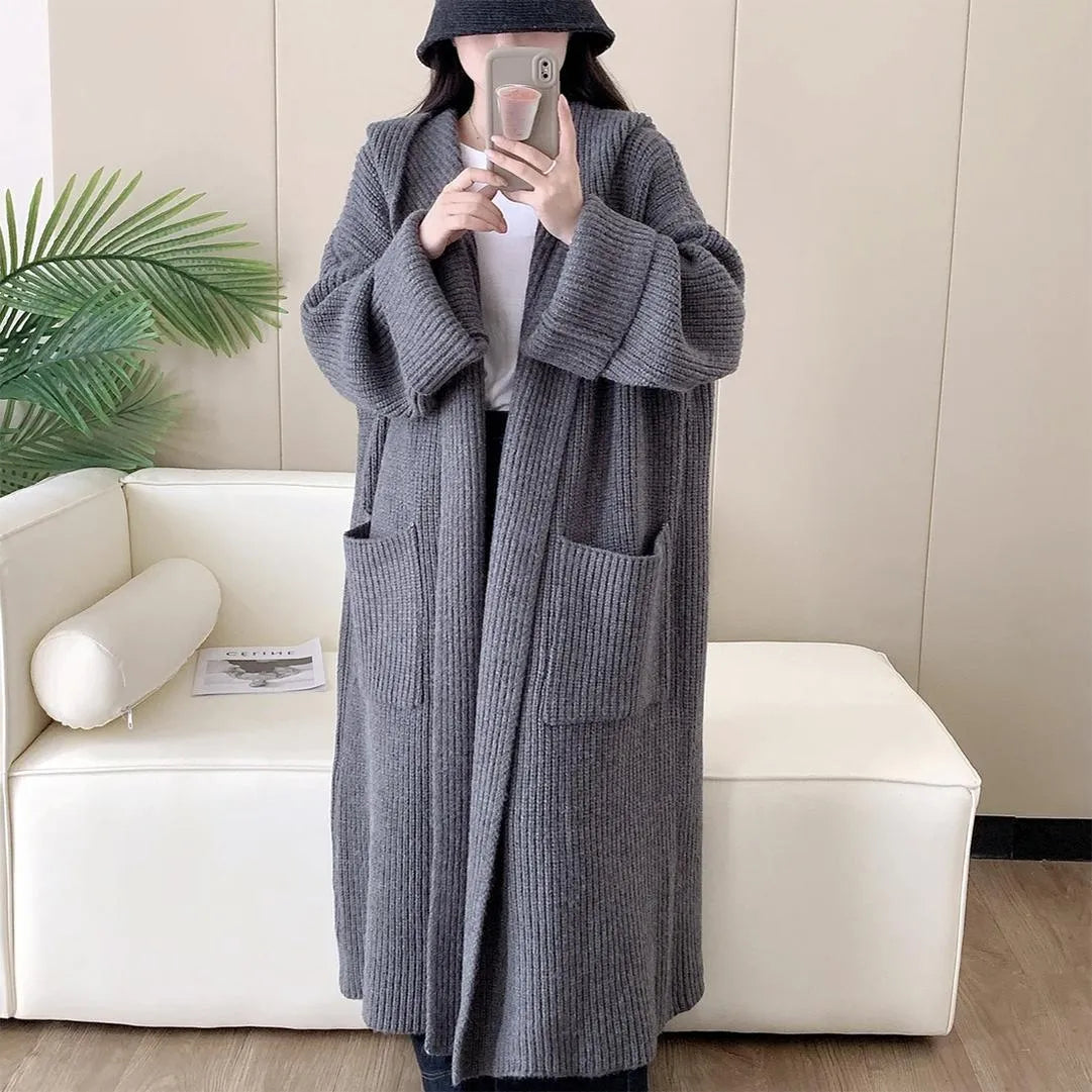 Loose hooded women's cardigan with raglan sleeves in milky white colour showing extended 80cm length