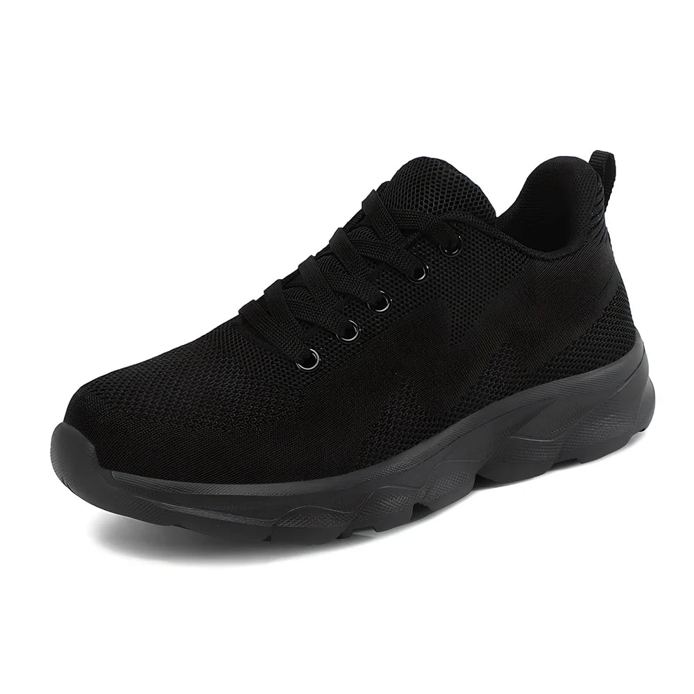 Women's black sneakers with mesh upper, wedge heel, and lace-up front