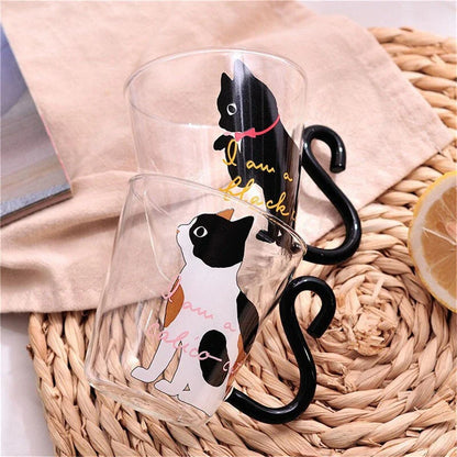 Adorable cat-shaped glass mug in black and white colors, perfect for coffee, tea, or juice