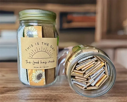 Handmade glass jar containing 67 color-coded Bible verses for emotional support