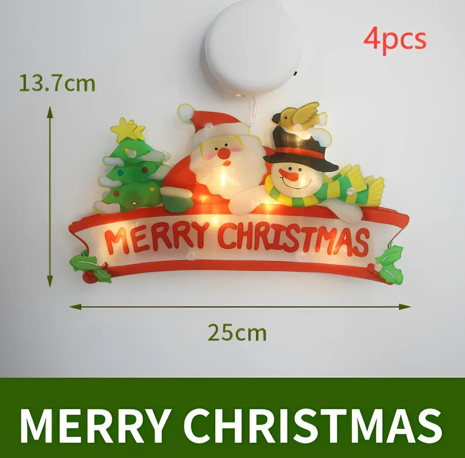 LED Christmas hanging lights with suction cups showing snowman design illuminated on window