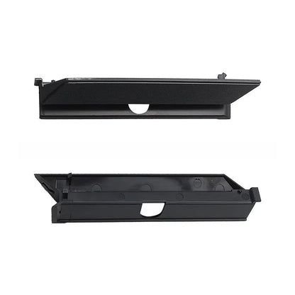 Black PS4 Pro hard drive bottom cover replacement part, showing internal clip design.