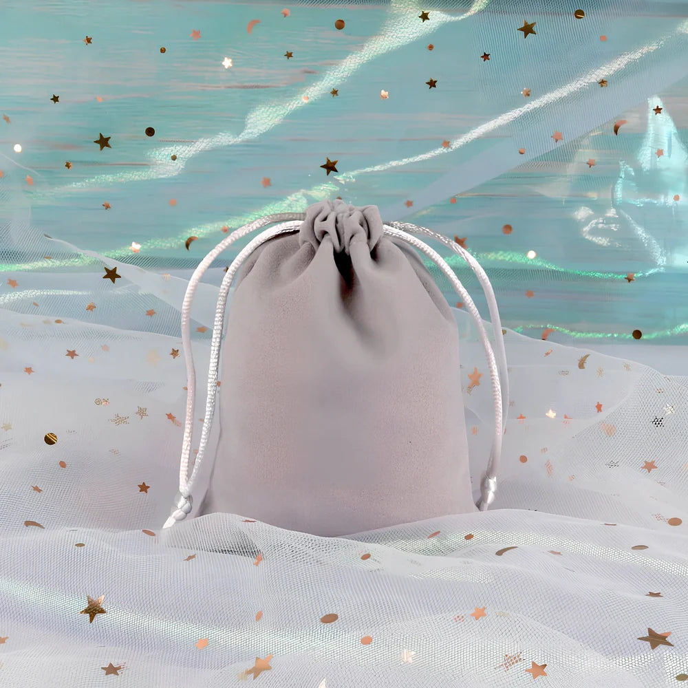 Multi-colour flannel jewellery storage bags in sizes 5x7cm to 20x30cm with gold drawstring and lining