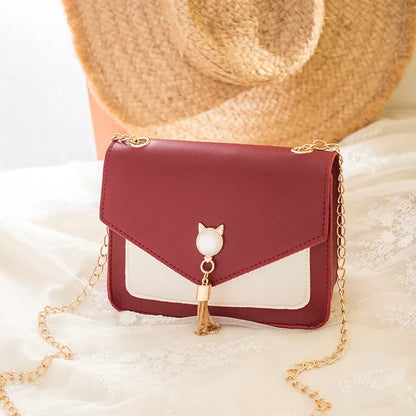 Small square messenger bag with cat tassel decoration and adjustable chain strap