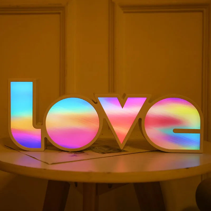 Rainbow halo LED love light with 'LOVE' word decoration on plastic casing.
