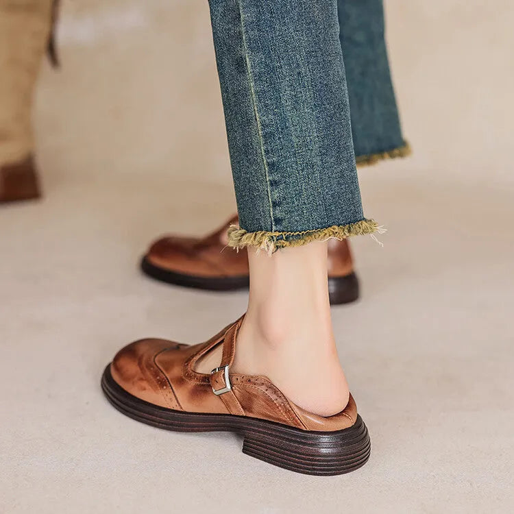 Women's flat shoes made from sheepskin leather with round toe design in solid black or brown colour, available in sizes 34-42 for casual everyday wear, British-style leather footwear for women