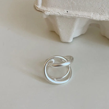 Geometric open ring with interlaced pattern and matte finish, adjustable for finger sizes 16mm to 20mm