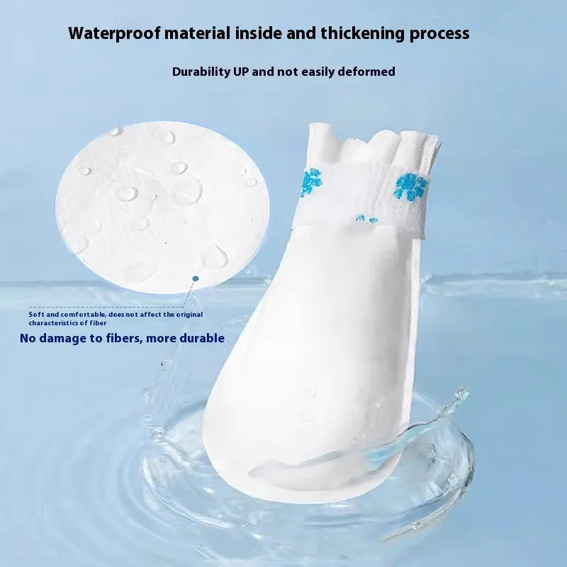 White disposable waterproof shoe covers for dogs, shown in a pack of 20.
