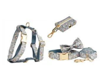 Blue floral dog collar set with adjustable sizes, includes leash, vest, bow, and poop bag on polyester cotton cloth.