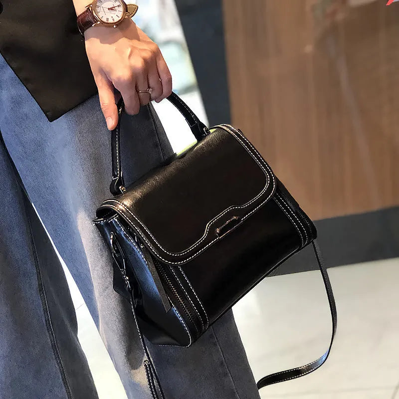 Women's genuine leather retro messenger bag in horizontal square shape with multiple internal compartments