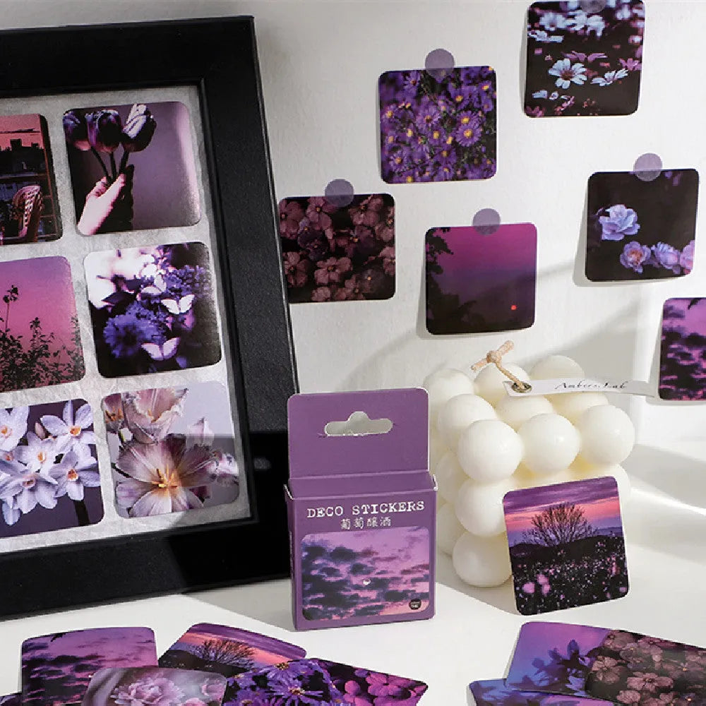 Box of 46 square decorative stickers with Nordic mountain, sea, and floral designs, each 44mm wide.